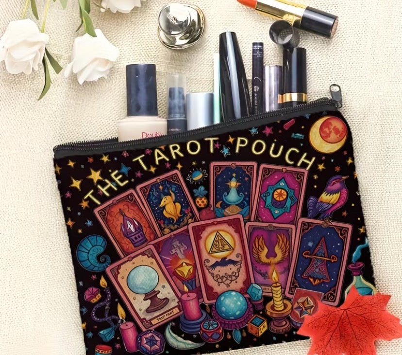 Tarot card design pouch with cosmetic items on a textured surface