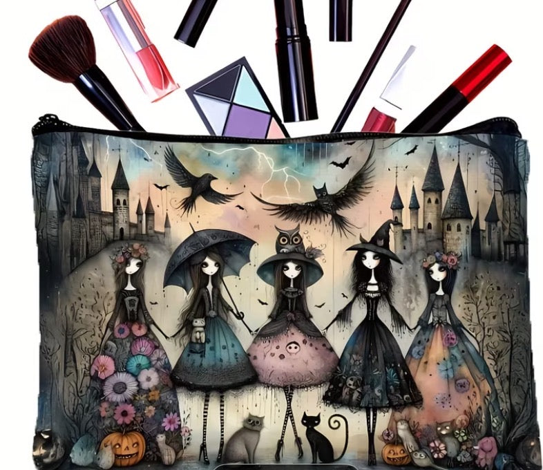 Makeup bag with Halloween-themed design of witches and cats, surrounded by makeup items.